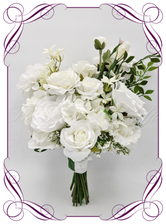 Artificial Bridal flowers in white and ivory flowers, with green foliage. Silk wedding Bouquet posy, featuring faux flowers in a romantic elegant and unusual bridal style, classic white and green wedding flowers, rustic wedding, boho flowers, traditional wedding bouquets. Made in Melbourne by Australia's Best Artificial Bridal Florist. Buy now Online. Worldwide Shipping available