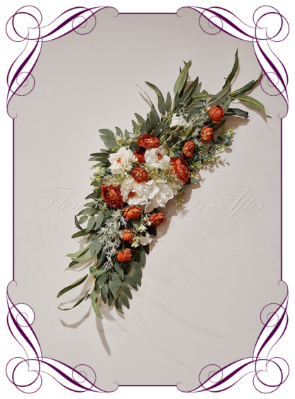 Wedding Ceremony Silk arbor flowers. Artificial rust burnt orange, white, and sage and blue green arbor florals decoration, for wedding ceremony backdrop decoration. Hydrangea, roses, peonies, native gum eucalypt foliage. Buy online now. Shipping world wide. Cheap wedding arbor decoration ideas.