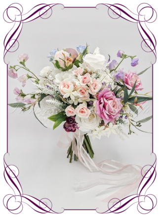 Whimsical romantic silk artificial pastel blue, lilac, lavender, white and pink Spring style bridal bouquet wedding flowers, including roses, ranunculus, chyrsanthemum, sweetpea, stephanotis, and native Australian gum foliage. Romantic wedding. Navy wedding. Pink wedding. Lilac wedding. Blush wedding. Spring wedding. Realistic silk flowers, modern whimsical style posy. Made in Melbourne. Shipping world wide, buy online.